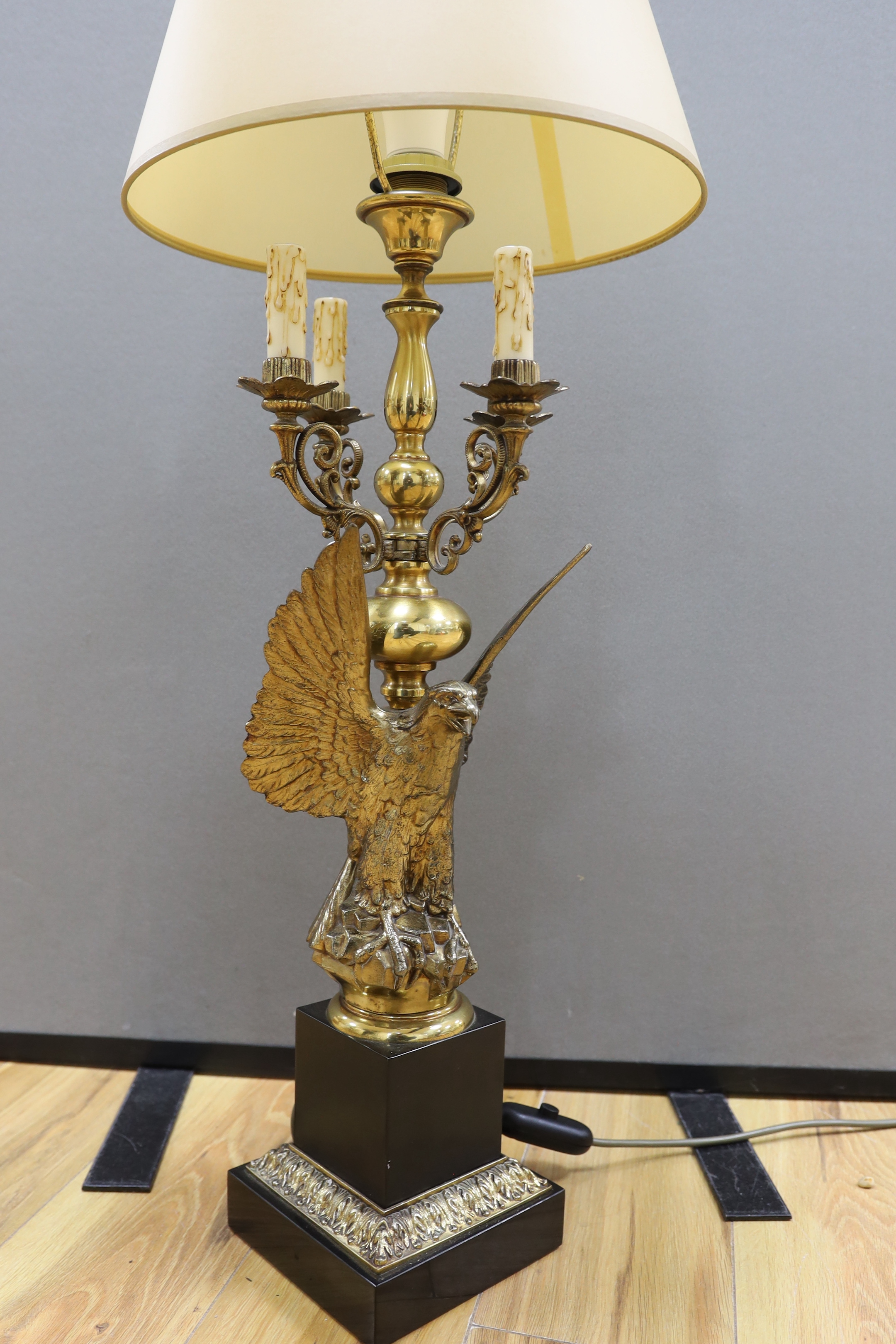 A gilt metal ‘eagle’ candelabrum, with shade, 93cm total